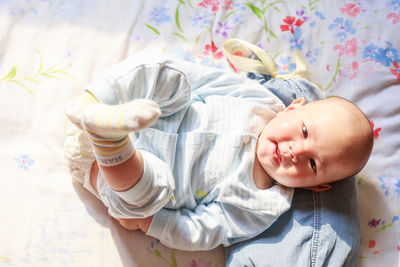 Directly above view of baby boy on bed