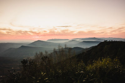 Scenic view of mountains against sky during sunset