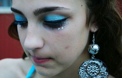 Close-up of thoughtful woman with eye make-up