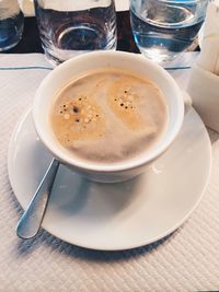 Close-up of coffee cup on table