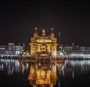 Reflection of illuminated buildings in water