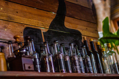 Low angle view of bottles on shelf