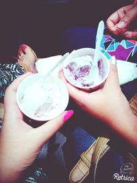 Midsection of woman holding ice cream in bowl