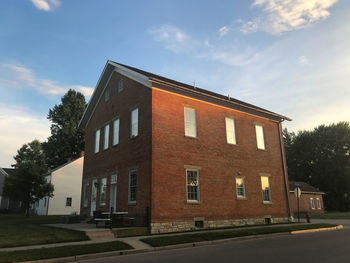 Building by road against sky