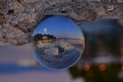 Close-up of crystal ball on water