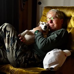 Portrait of cute boy with dog at home