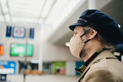 Portrait of man wearing hat and a face mask