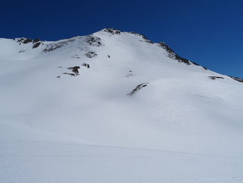 Snow covered mountain against sky