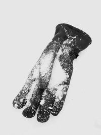 Close-up of hand against black background