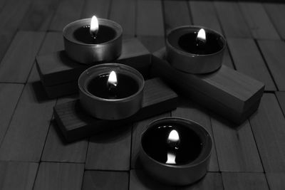 High angle view of tea light candles on table