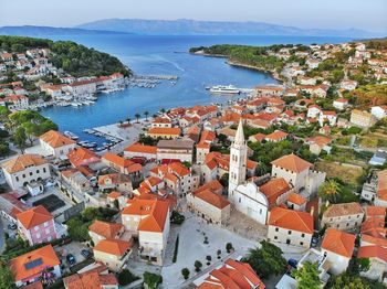 High angle view of townscape by sea