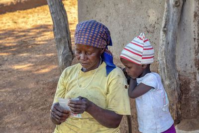 Full length of a girl holding umbrella