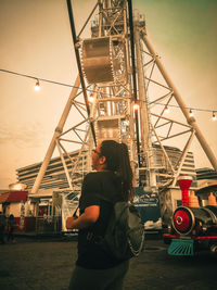 Rear view of people at amusement park