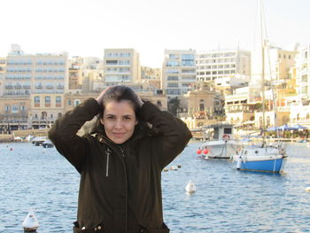 A wonderful day in malta. portrait of smiling woman standing in sea