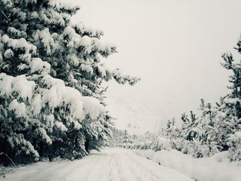Scenic view of snow covered landscape against clear sky