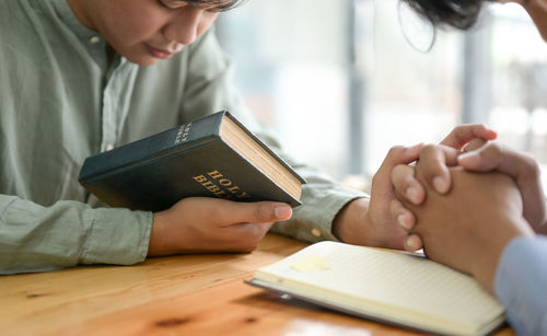 Close-up of woman holding book