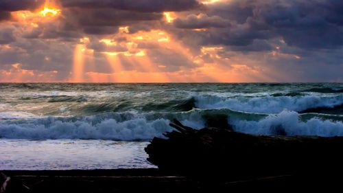 Scenic view of sea at sunset