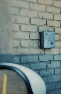 Close-up of electric lamp on wall