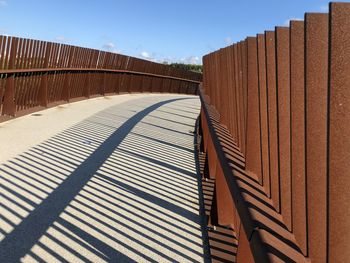 View of railing against clear blue sky