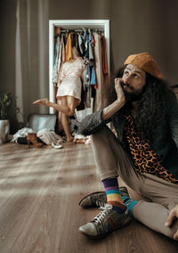 Woman sitting on floor at home