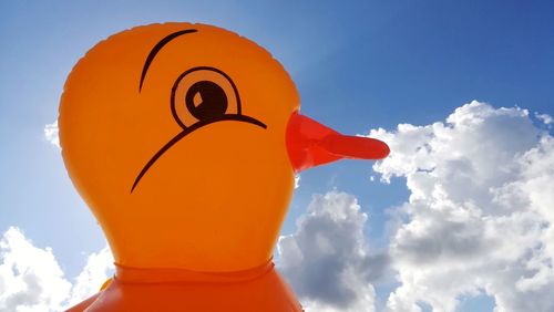 Low angle view of balloon against cloudy sky