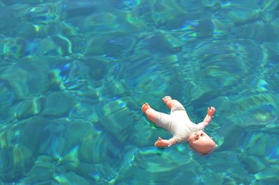 High angle view of a doll in swimming pool