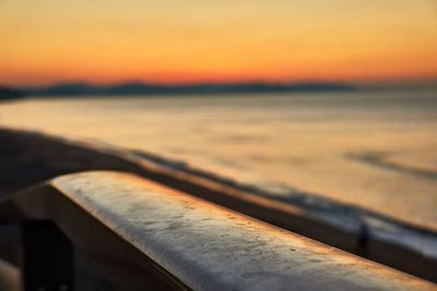 Close-up of sea shore during sunset