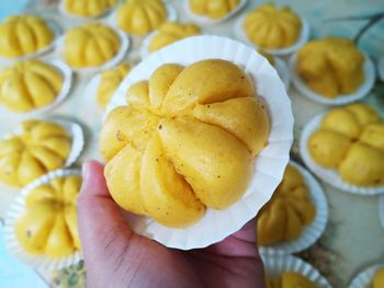 High angle view of hand holding fruit