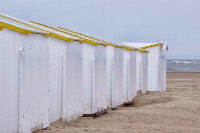 Lifeguard hut on beach against clear sky