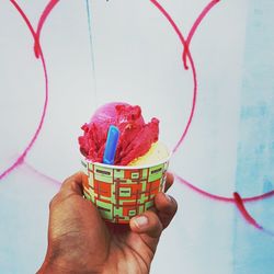 Close-up of hand holding ice cream cone