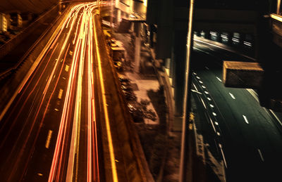 Light trails on road in city at night