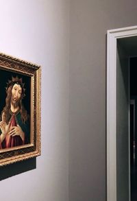 Statue by window in building