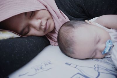 Cute baby sleeping on bed