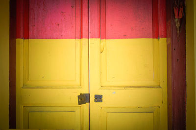 Red and yellow wooden door of building