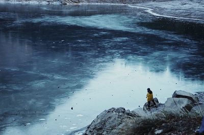 Woman in lake during winter