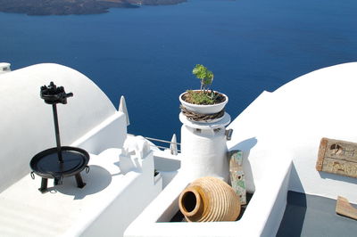 High angle view of potted plant on table by sea