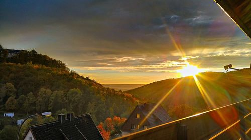 Panoramic view of buildings against sky during sunset