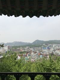 Buildings in city against sky