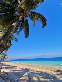 Scenic view of sea against blue sky