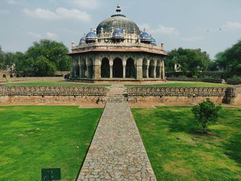 View of historical building against cloudy sky