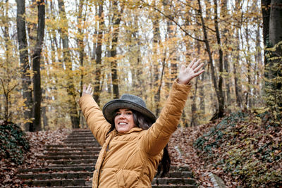 Portrait of a beautiful young woman, autumn, forest, outdoors.