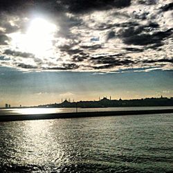 Scenic view of sea against cloudy sky