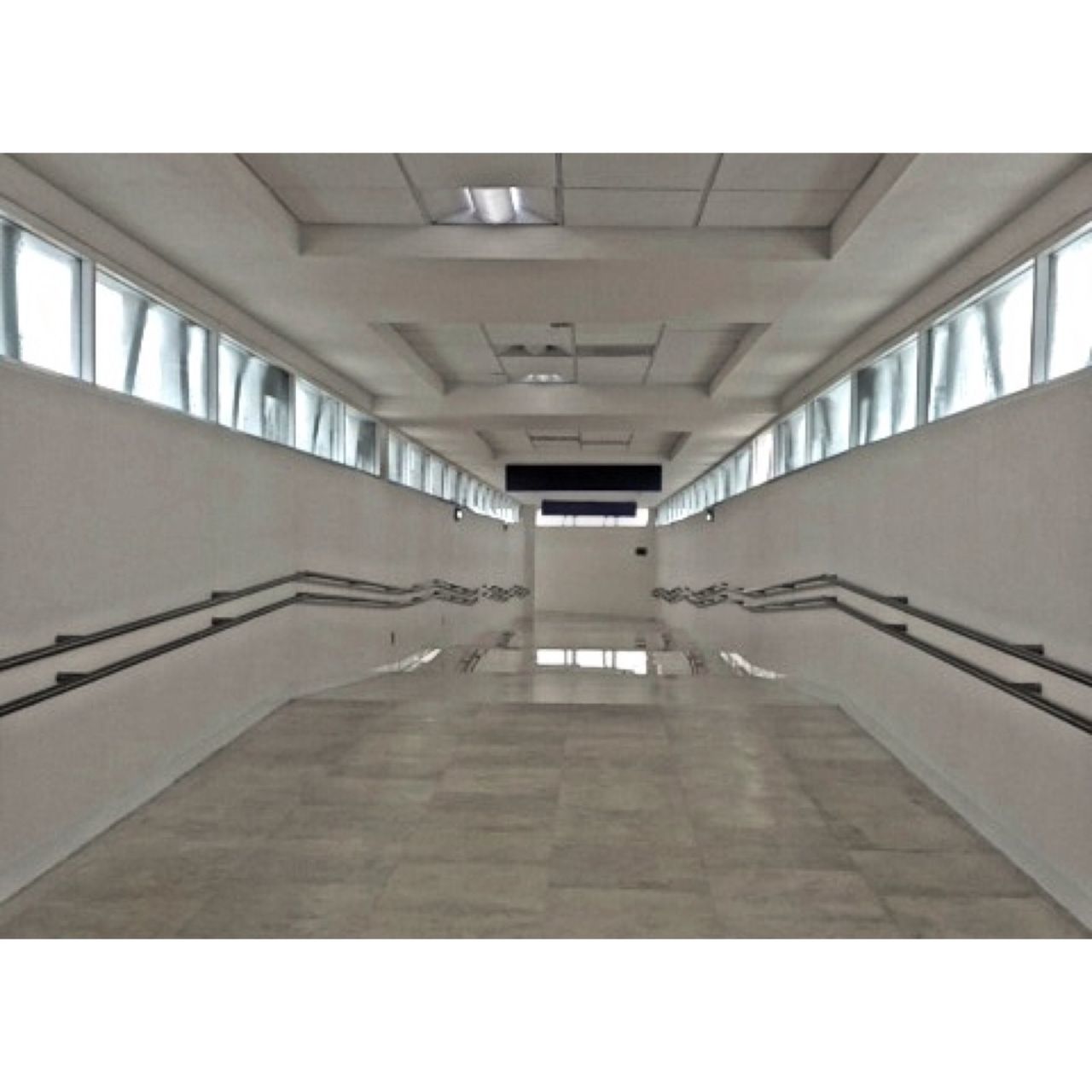 architecture, built structure, indoors, the way forward, ceiling, diminishing perspective, empty, transfer print, railing, building, corridor, absence, auto post production filter, vanishing point, modern, no people, long, sunlight, flooring, narrow