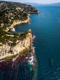 Aerial view of cliff by sea