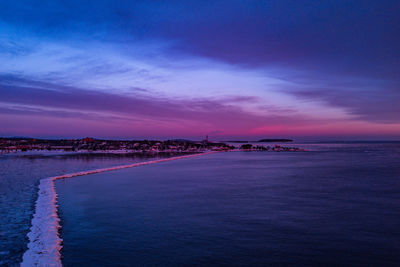Scenic view of sea against sky at sunset