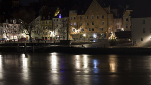 Illuminated buildings in town at night