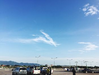 Airplane on airport runway against sky