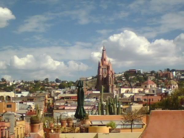 building exterior, architecture, built structure, sky, cloud - sky, religion, place of worship, cityscape, residential district, church, spirituality, residential structure, house, town, residential building, townscape, city, roof, cloudy