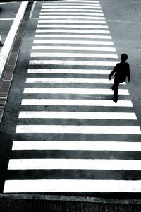 High angle view of man on zebra crossing