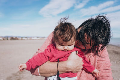 Close-up of father with daughter standing outdoors